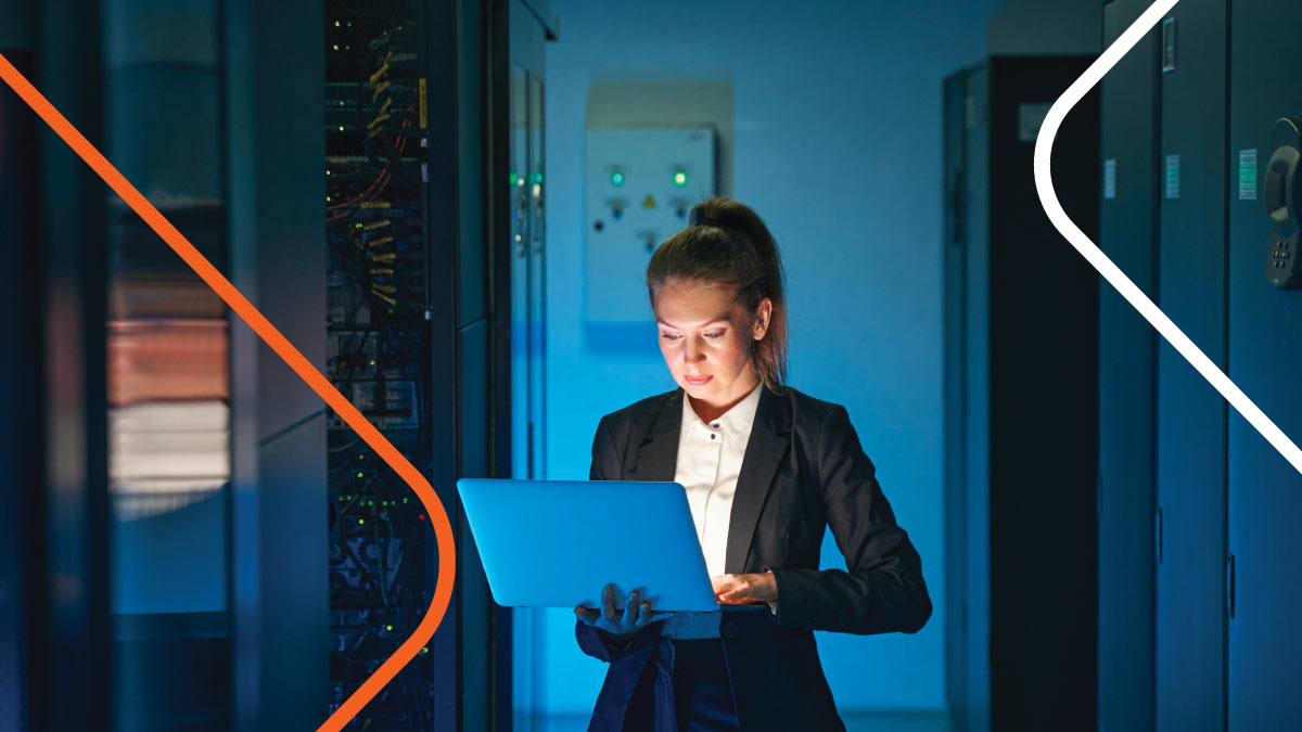 Woman with ponytail working in server room