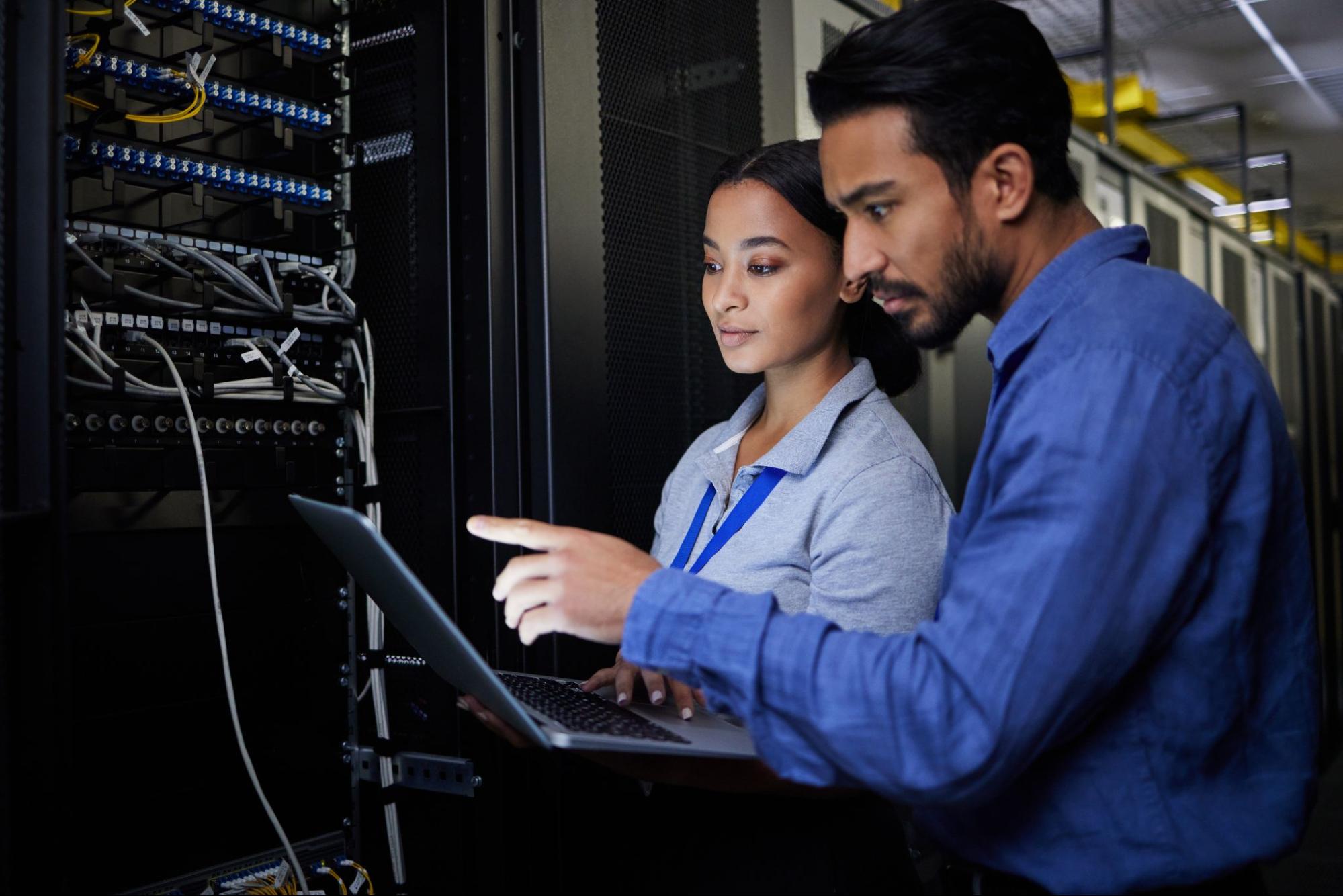 IT technicians troubleshooting server equipment