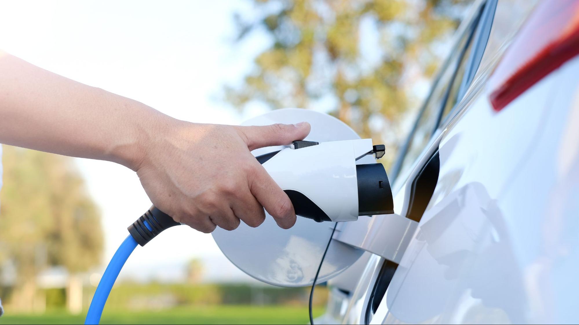 Plugging in an electric vehicle charger