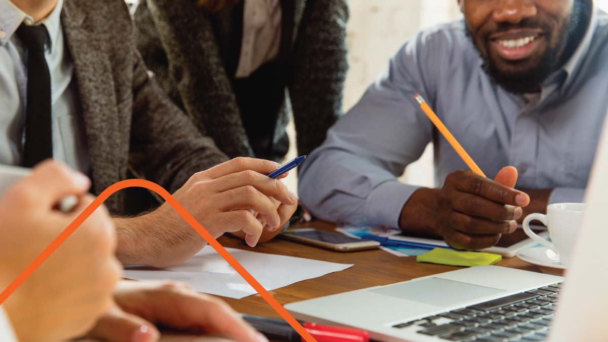 Team collaborating on documents at a table