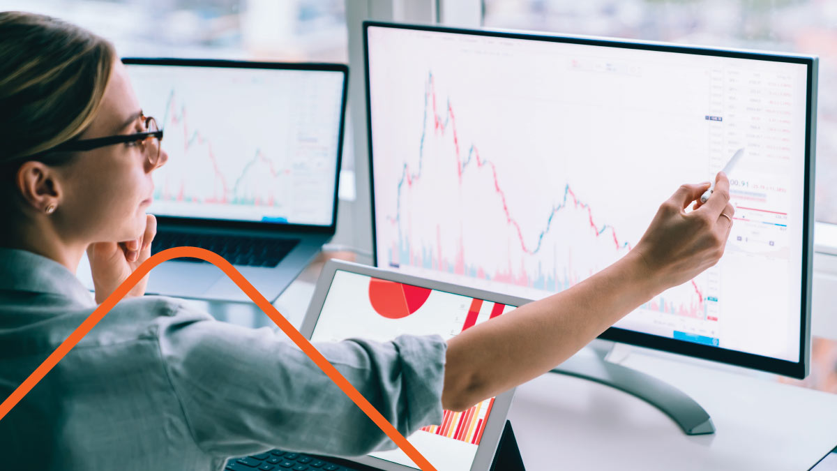 Woman Looking at Data on Computer