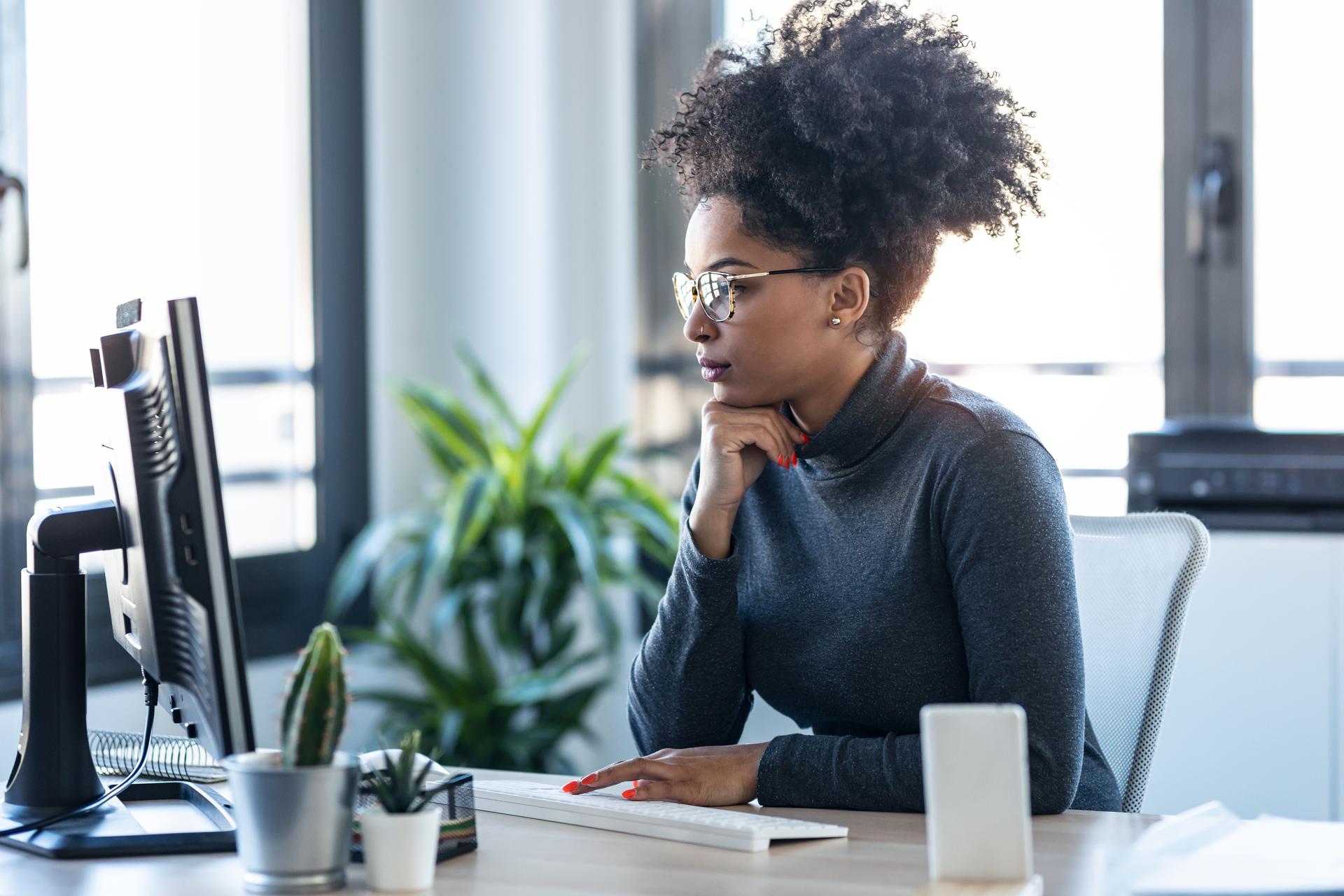 Woman concentrating on computer screen