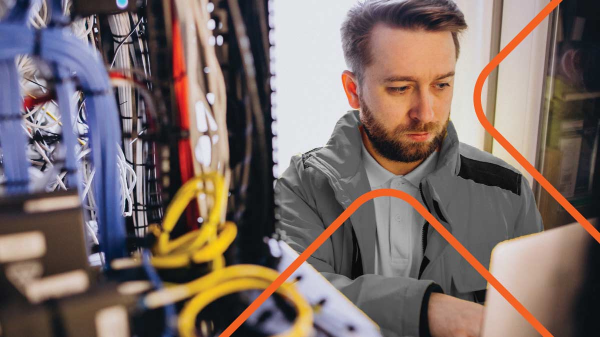 A man working fixing a cabling structure