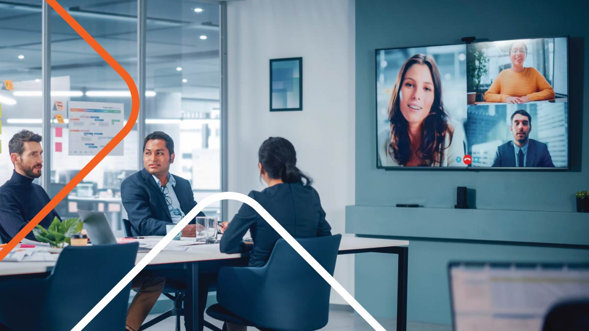 Office meeting showing three people on screen working remotely.