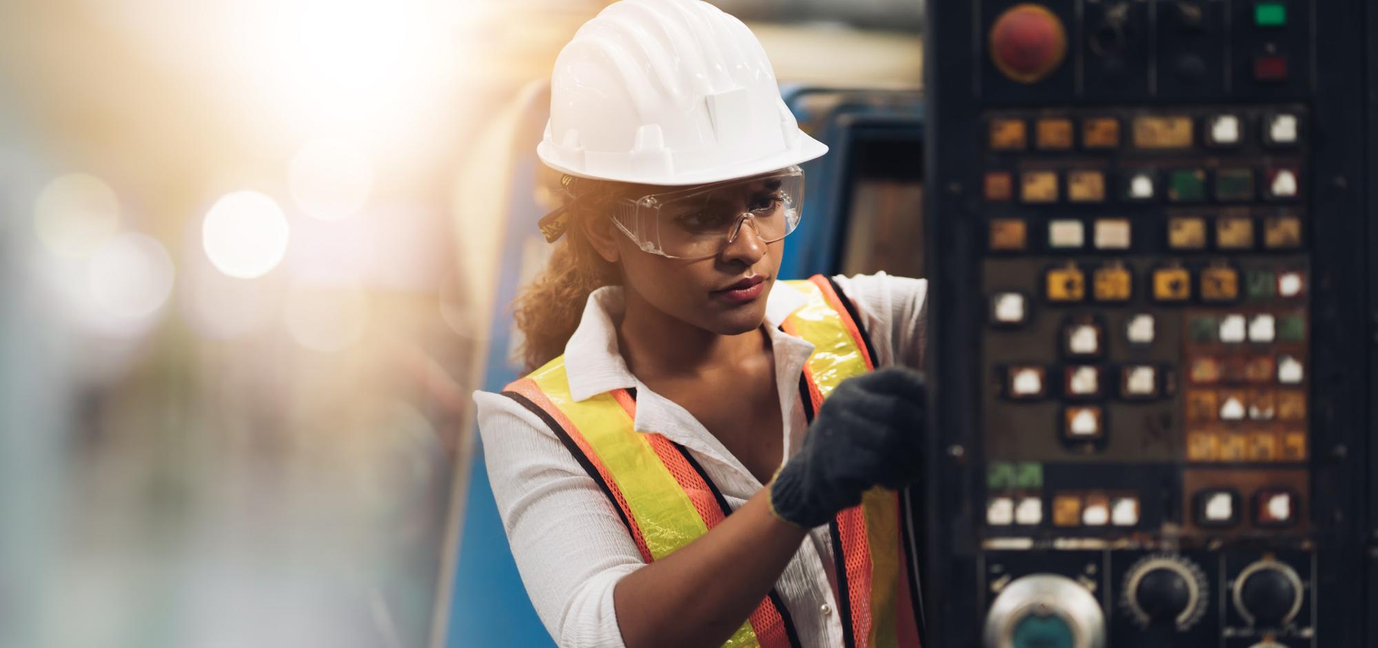 woman in PPE working on site